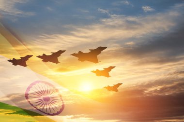Indian Air Force Day. Indian jet air shows on background of sunset with transparent Indian flag. Commemorate Indian Air Force Day on October 8 in India.