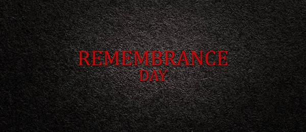 Text Remembrance Day on black textured background. Remembrance Day, Memorial Day, Anzac Day in New Zealand, Australia, Canada and Great Britain. Banner.