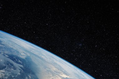 Bir yıldız alanındaki uzaydan gelen dünya. Bu görüntünün elementleri NASA tarafından desteklenmektedir.