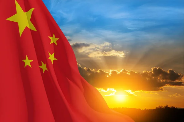 Close up waving flag of China on background of sunset sky. Flag symbols of China. National day of the people\'s republic of China. 1st october. 3d rendering.