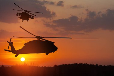 Gün batımının arka planında helikopter siluetleri. Gaziler Günü için tebrik kartı, Anma Günü, Hava Kuvvetleri Günü. ABD kutlaması.