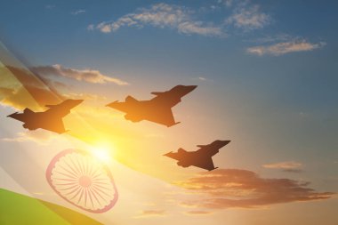 Indian Air Force Day. Indian jet air shows on background of sunset with transparent Indian flag. Commemorate Indian Air Force Day on October 8 in India.