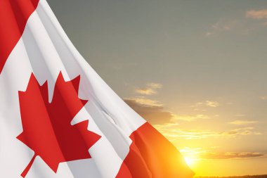 Canada national flag waving on sunset sky. Canada day. 3d-rendering.