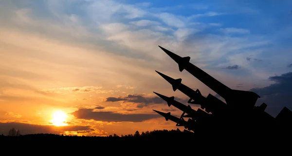 stock image The missiles are aimed to the sky at sunset. Nuclear bomb, chemical weapons, missile defense, a system of salvo fire.