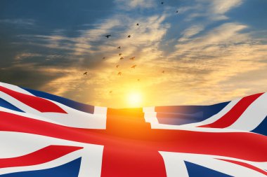 National flags of United Kingdom with flying birds on sunset sky background. Background with place for your text. 3d rendering.