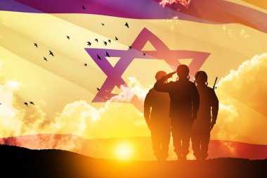 Silhouettes of soldiers saluting against the sunrise in the desert and Israel flag. Concept - armed forces of Israel. clipart