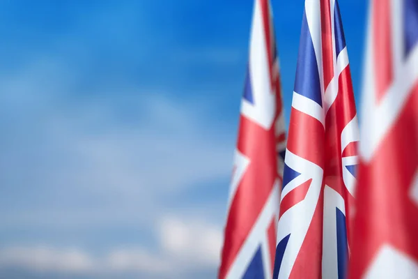 National Flags United Kingdom Flagpole Blue Sky Background Lowered Flags — Photo