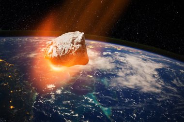 Planet Earth and big asteroid in the space. Potentially hazardous asteroids. Asteroid in outer space near Earth planet. Elements of this image furnished by NASA.