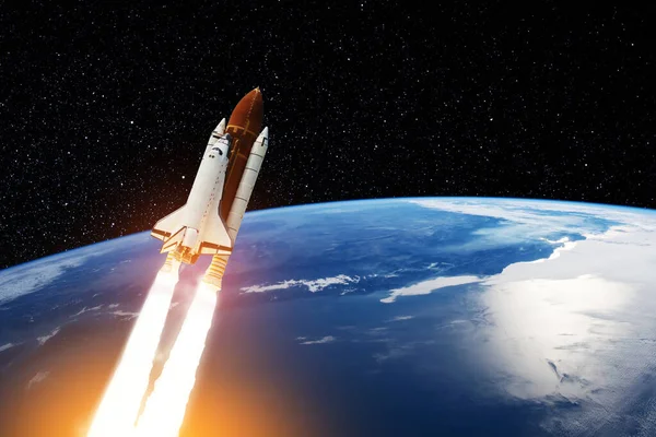 stock image Spaceship lift off. Space shuttle with smoke and blast takes off into the starry sky. Rocket starts into space. Concept. Elements of this image furnished by NASA.