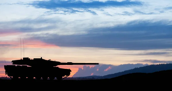 stock image Silhouette of army tank at sunset sky background. Military machinery.