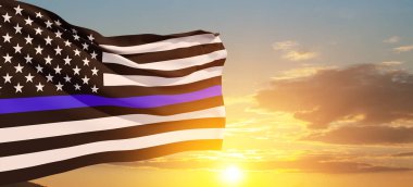 American flag with police support symbol Thin blue line on sunset sky. American police in society as the force which holds back chaos, allowing order and civilization to thrive. Banner.