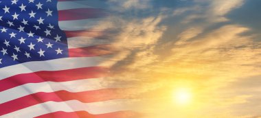 United States of America flag on sky at sunset or sunrise background. Independence day, Memorial day, Veterans day. Banner.