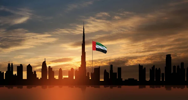日落时 阿拉伯联合酋长国的国旗和迪拜的天际线景观 阿联酋庆祝活动 国庆节 国旗日 纪念日 烈士日 — 图库照片