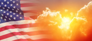 United States of America flag on sky at sunset or sunrise background. Independence day, Memorial day, Veterans day. Banner.