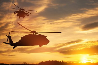 Gün batımının arka planında helikopter siluetleri. Gaziler Günü için tebrik kartı, Anma Günü, Hava Kuvvetleri Günü. ABD kutlaması.