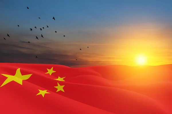 Close up waving flag of China on background of sunset sky with flying birds. Flag symbols of China. National day of the people\'s republic of China. 1st October. 3d rendering.