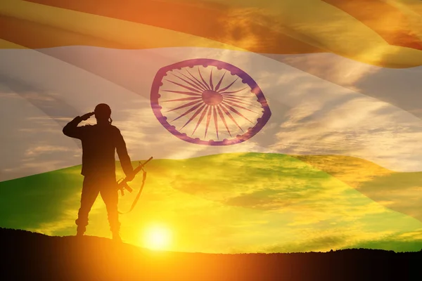 stock image Silhouette of soldier on a background of India flag and the sunset or the sunrise. Greeting card for Independence day, Republic Day. India celebration.