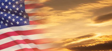 United States of America flag on sky at sunset or sunrise background. Independence day, Memorial day, Veterans day. Banner.