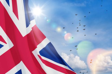National flags of United Kingdom with flying birds on blue sky background. Background with place for your text. 3d rendering.
