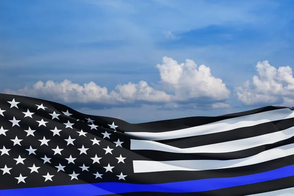 American flag with police support symbol Thin blue line on blue sky. American police in society as the force which holds back chaos, allowing order and civilization to thrive. 3d-rendering.