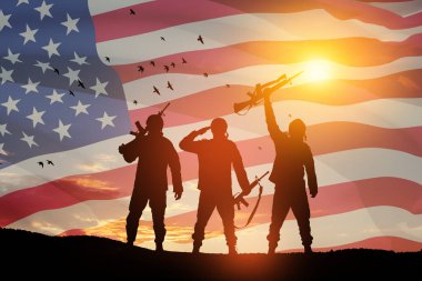 USA army soldiers on a background of sunset or sunrise and USA flag. Greeting card for Veterans Day, Memorial Day, Independence Day. America celebration. 3D-rendering.