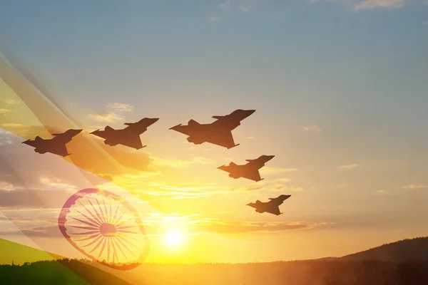 Indian Air Force Day. Indian jet air shows on background of sunset with transparent Indian flag. Commemorate Indian Air Force Day on October 8 in India.