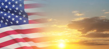 United States of America flag on sky at sunset or sunrise background. Independence day, Memorial day, Veterans day. Banner.