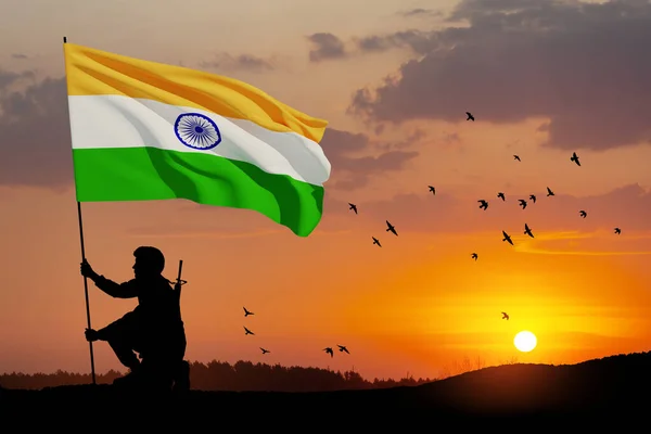 stock image Silhouette of soldier with India flag and flying birds on a background the sunset or the sunrise. Greeting card for Independence day, Republic Day. India celebration.