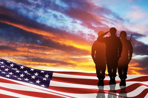 stock image USA army soldiers saluting with nation flag on a background of sunset or sunrise. Greeting card for Veterans Day, Memorial Day, Independence Day. America celebration. 3D-rendering.