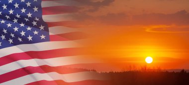 United States of America flag on sky at sunset or sunrise background. Independence day, Memorial day, Veterans day. Banner.