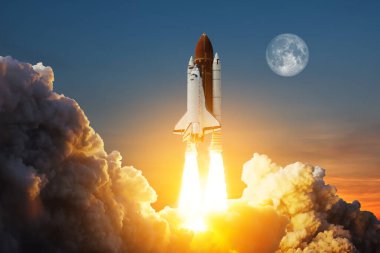 Spaceship lift off. Space shuttle with smoke and blast takes off into space on a background of a sunset with a full moon in the sky. Elements of this image furnished by NASA.