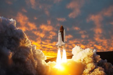 Spaceship lift off. Space shuttle with smoke and blast takes off into space on a background of sunset. Successful start of a space mission. Elements of this image furnished by NASA. clipart