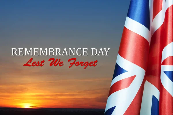 stock image Flag of Great Britain with Text on background of sunset. Holidays of the UK. Remembrance Day.