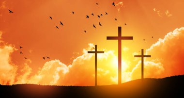 Christian cross on hill outdoors at sunrise. Resurrection of Jesus. Concept photo.