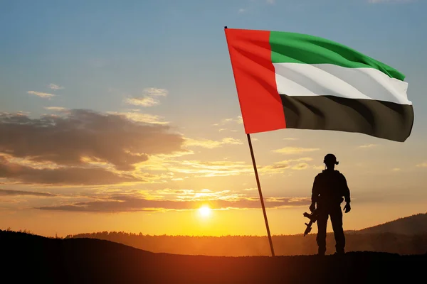 stock image Silhouette of soldier with the flag of UAE against sunset or sunrise. Concept of national holidays. Commemoration Day.