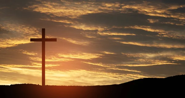 stock image Christian cross on hill outdoors at sunrise. Resurrection of Jesus. Concept photo.