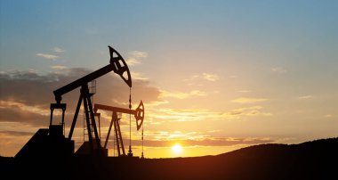 The change in oil prices caused by the war. Oil prices are rising because of the global crisis. Oil drilling derricks at desert oilfield. Crude oil production from the ground. Petroleum production.