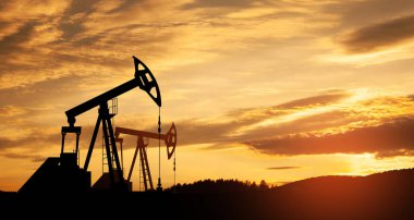 The change in oil prices caused by the war. Oil prices are rising because of the global crisis. Oil drilling derricks at desert oilfield. Crude oil production from the ground. Petroleum production.