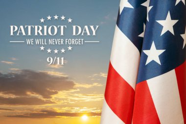 Günbatımı arka planında ABD bayrağı. Terörist saldırıların kurbanları için Ulusal Namaz ve Anma Günü. Vatanseverlik Günü.