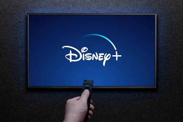 Disney Plusz Logó Tévében Ember Bekapcsolja Tévét Távirányítóval Disney Egy — Stock Fotó
