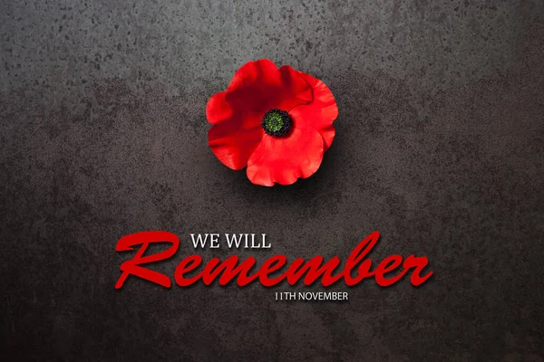 We Will Remember 11th November inscription with Poppy flower on rusty iron background. Decorative flower for Remembrance Day. Memorial Day. Veterans day.