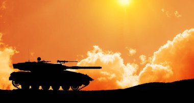 Silhouette of army tank at sunset sky background. Military machinery.