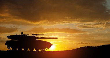 Silhouette of army tank at sunset sky background. Military machinery.