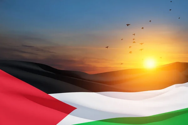 Stock image Palestine flag on background of sunset sky with flying birds. Patriotic concept. Banner with place for text.