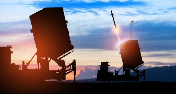 Israel\'s Iron Dome air defense missile launches. The missiles are aimed at the sky at sunset. Missile defense, a system of salvo fire.