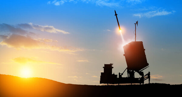 Israel's Iron Dome air defense missile launches. The missiles are aimed at the sky at sunset. Missile defense, a system of salvo fire.