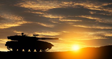 Silhouette of army tank at sunset sky background. Military machinery.