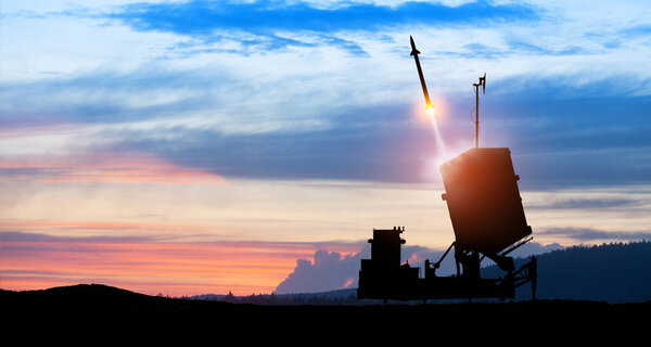 Israel's Iron Dome air defense missile launches. The missiles are aimed at the sky at sunset. Missile defense, a system of salvo fire.