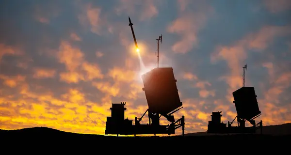 Israel\'s Iron Dome air defense missile launches. The missiles are aimed at the sky at sunset. Missile defense, a system of salvo fire.
