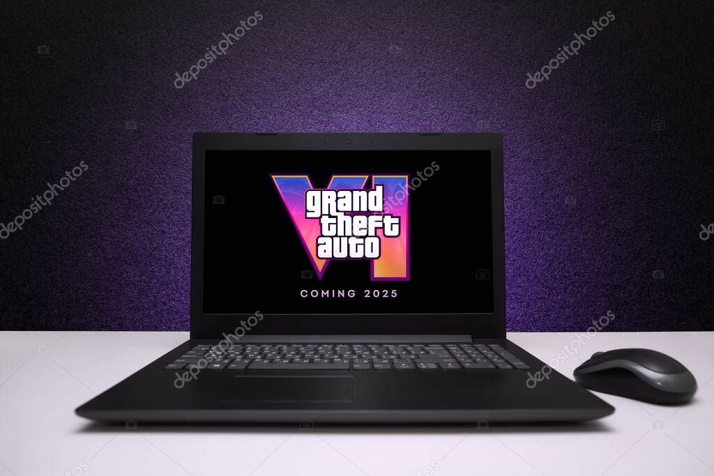 Grand Theft Auto 6 trailer game on the screen laptop computer with mouse on black textured wall with purple light. Astana, Kazakhstan - December 5, 2023.